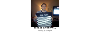 Niklas Kronwall, Stanley Cup Champion, smiling while holding the Chi-mat acupressure mat.